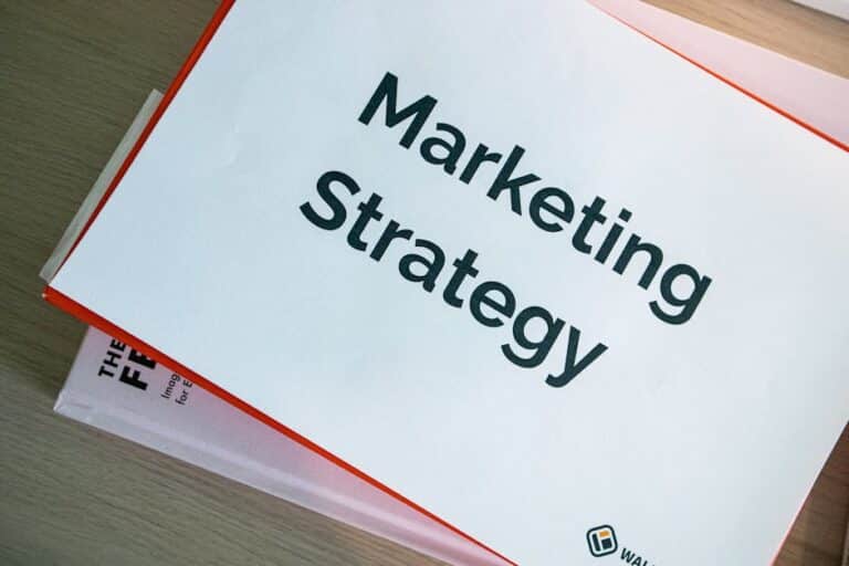 Marketing Strategy image for the blog What Makes a Good Marketing Package?. a notebook page with the words Marketing Strategy on it