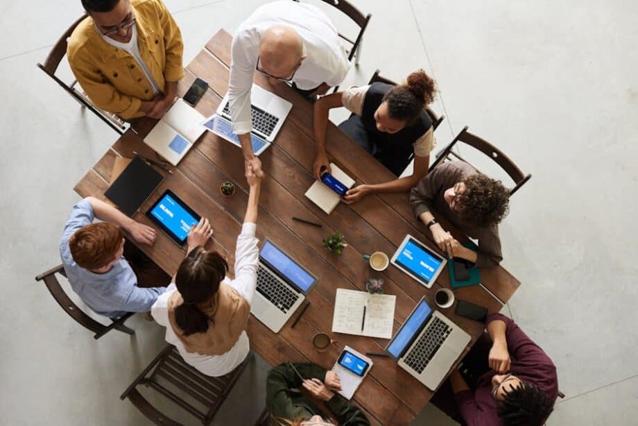 A group working at a desk on their story telling techniques