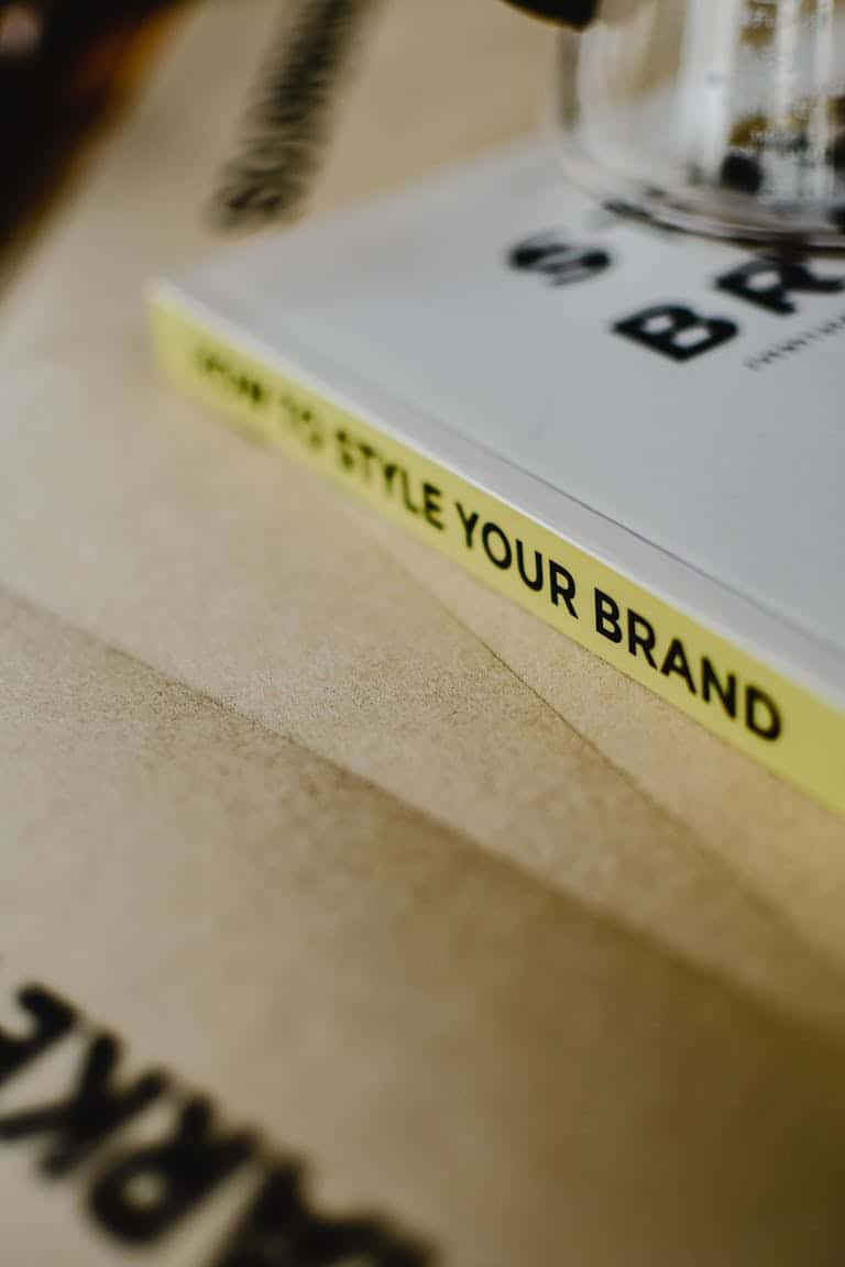 A close-up of a book titled "How to Style Your Brand" on a paper background. The Ultimate Guide to Branding Services: What They Are, Why They Matter, and How to Get It Right