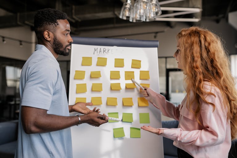 A diverse team of professionals brainstorming marketing strategies in a modern office.