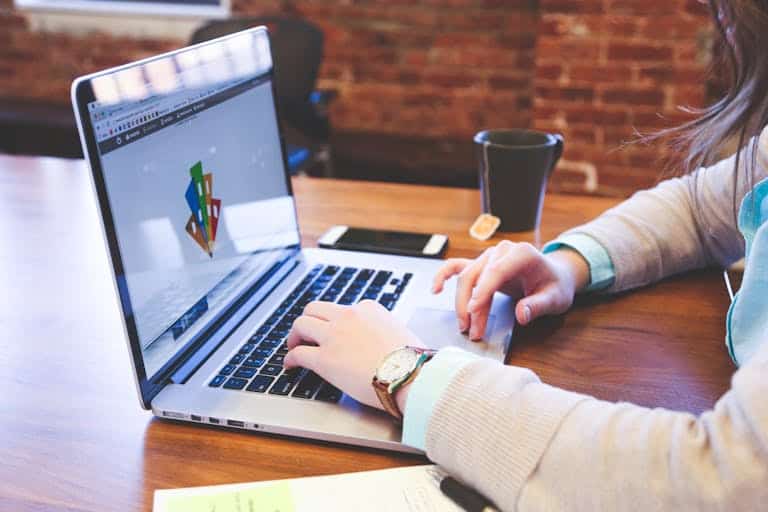 Woman working on design project using laptop at modern workspace indoors. Digital Branding Agency That Gets Your Message Right