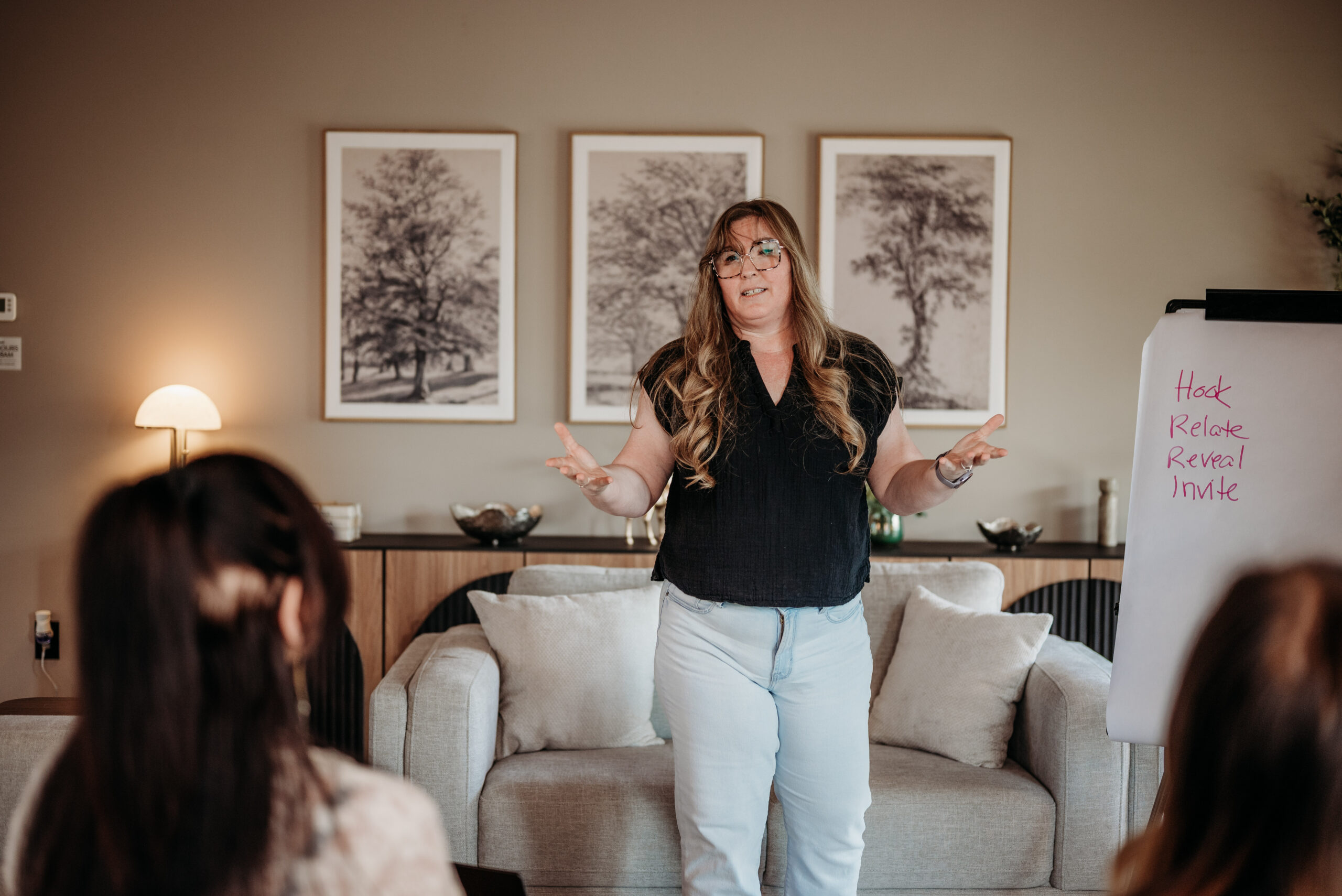 Female veteran business speaker Lisa Benson teaching a live workshop